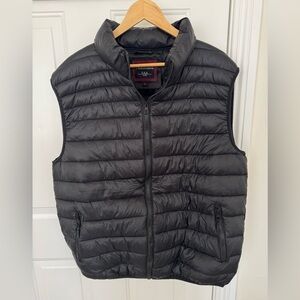 Black Maximos Lightweight half sleeve insulated packable puffer jacket.